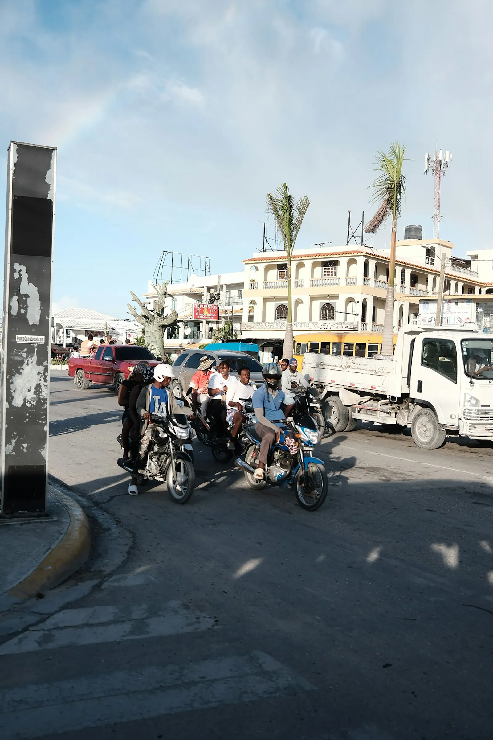 Motorbikes riding down a busy street